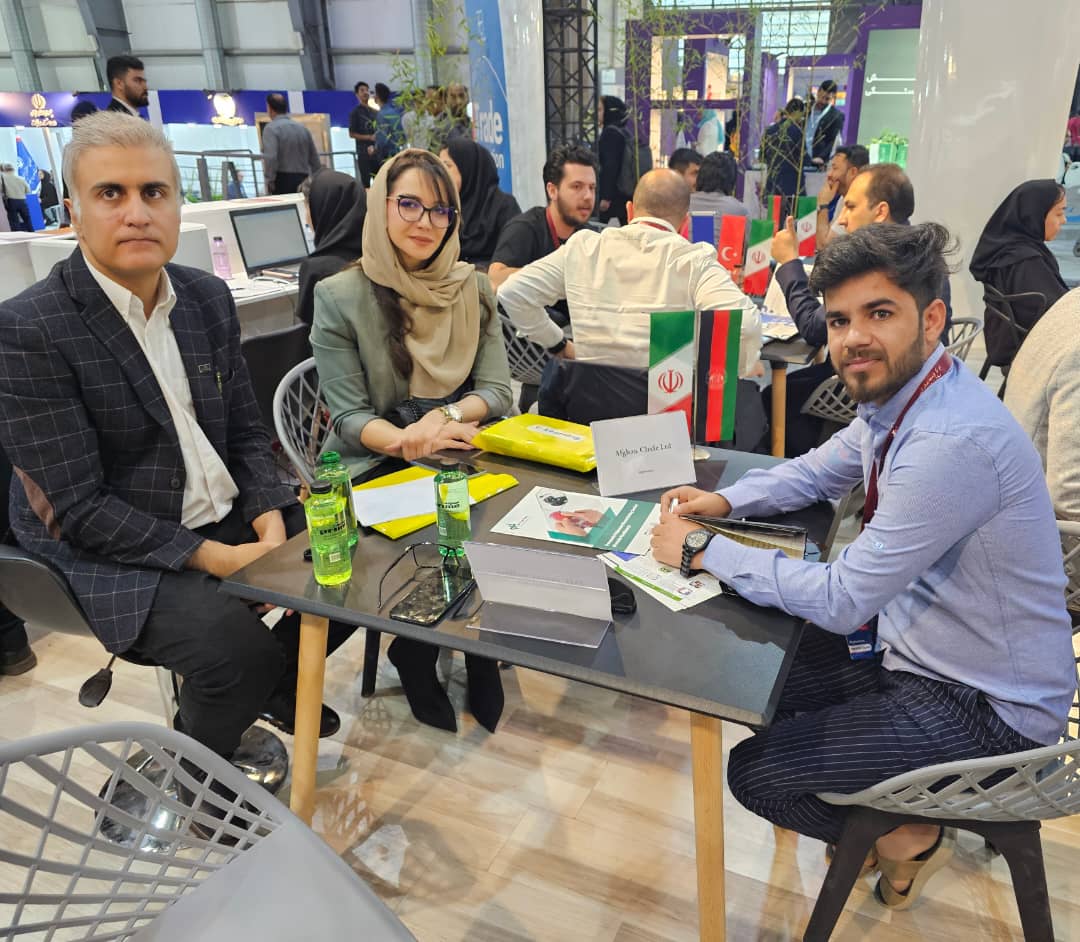 Afghan Circle Ltd. team meeting buyers at an international trade exhibition.